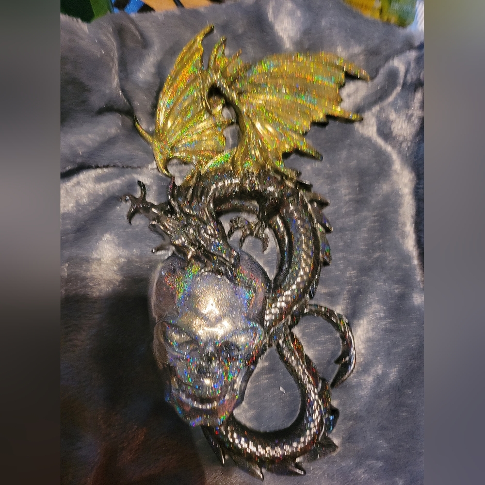 Unique resin dragon and skull wall hanging.